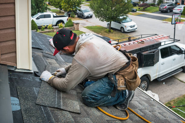 Professional Storm Damage Roof Repair technician working in Hudson, IL